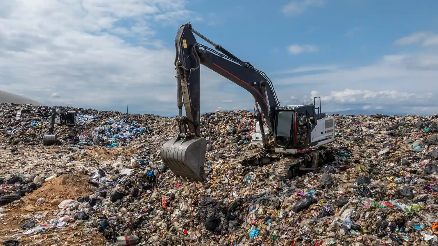 bulldozer working on massive landfill